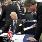 British member of the European Parliament Godfrey Bloom talks with UKIP party chief Nigel Farage, at the European Parliament in Strasbourg. Bloom was expelled from the European Parliament chamber Wednesday for calling German Socialist MEP Martin Schulz an 