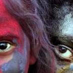 Indian kids smeared with colors look on as they celebrate 'Holi,' the Indian festival of colors, in Calcutta, India, Sunday, Feb. 28, 2010. The festival also marks the coming of spring. 

(AP Photo/Sucheta Das)