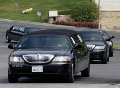 Mourners' cars leaving the LA cemetery where Liz Taylor was laid to rest yesterday