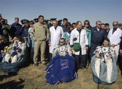 The International Space Station crew of US astronaut Cady Coleman, left, Russian cosmonaut Dmitry Kondratiev, center, and Italian astronaut Paolo Nespoli.
