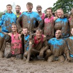 Myriam Vogt 36, from France (top right) and her team Highway to Love which lost to a team called The Mud Company, during the Swamp Soccer World Cup being held at Hunters Hall Park in Edinburgh. Pic: Andrew Milligan/PA Wire