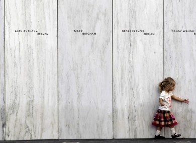 A family member of one of the victims of the crash of United Flight 93 walks along a section of Phase 1 of the permanent National Memorial following its dedication, near the crash site of Flight 93 in Shanksville