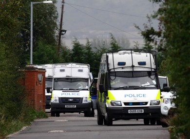 Police vans at the Greenacre caravan site in Leighton Buzzard this morning.