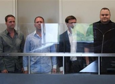 MegaUpload founder Kim Dotcom, far right with three of his employees in a New Zealand court today.