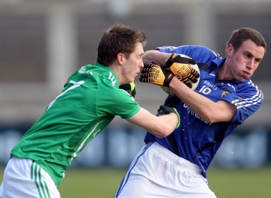 Leinster's Kevin Nolan and Munster's Patrick Kelly tussle for possession.