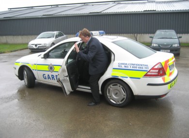 John Dillon gets into a Garda car after his arrest in Co Limerick this morning.