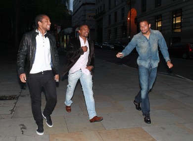 Bebe (right) heads out with Anderson and Patrice Evra in Manchester after United captured the league title in May 2011