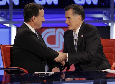Rick Santorum (left) and Mitt Romney didn't quite appear arm-in-arm - but Santorum has nonetheless given Romney his backing in November's presidential election.