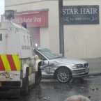 Police ram a car set on fire by Nationalists (Photo: Laura Hutton/Photocall Ireland)