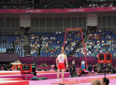 Empty seats are seen during the Artistic Gymnastics team qualification at the North Greenwich Arena, London yesterday