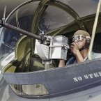 Jesse Rhodes Waller, A.O.M., third class, prepared for a fight by installing and testing 30-caliber machine guns on Navy planes at a base in Corpus Christi, Texas