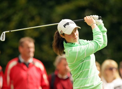 Leona Maguire studies her iron approach.