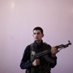 Badir Farouh, 17, joined the fighters six months ago with the blessing of his father. He has already been arrested and beaten twice. (AP Photo/Muhammed Muheisen)