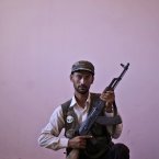 Syrian rebel fighter, Mohammed Abu Razouk, 27, at a rebel headquarters in Marea on the outskirts of Aleppo city. (AP Photo/Muhammed Muheisen)