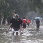 Residents wade along a flooded area in Marikina, east of Manila, Philippines.
(AP Photo/John Javellana)