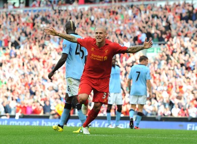 Liverpool's Martin Skrtel celebrates after scoring his team's opening goal on Sunday.