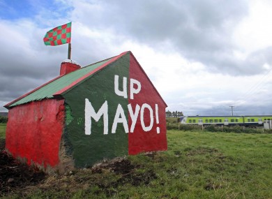 A view of a painted shed in a field on the road to Claremorris.