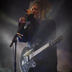 Robert Smith of The Cure performs on the main stage at Electric Picnic last night. Photo: Andres Poveda