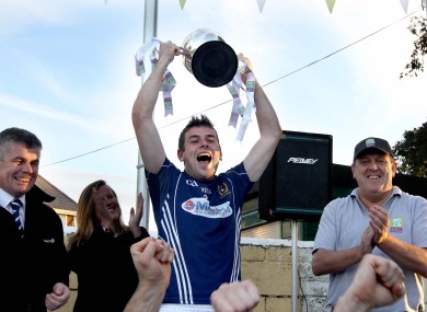 St. Galls' Sean Burke lifts the trophy.