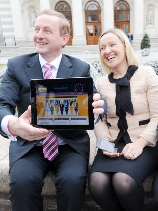 Enda Kenny and Lucinda Creighton launch a Fiscal Compact website using an iPad. Oireachtas plans to supply a tablet machine to every TD have been stalled over procurement technicalities.