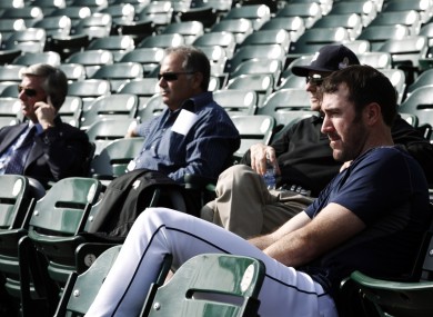 Detroit pitcher Justin Verlander, right, a workout with Tigers officials yesterday.