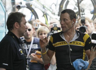 Lance Armstrong, right, talks to Johan Bruyneel in 2009 (file photo).