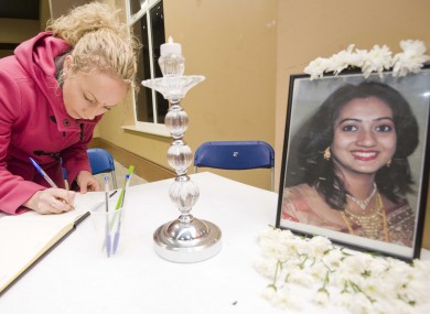 Una Jones from Celbridge signs a book of condolence for Savita Halappanavar at the CityWest Convention Centre in Dublin as part of the Diwali Festival of Lights.