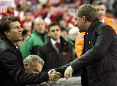 Liverpool's manager Brendan Rodgers, right, shakes hands with Swansea's manager Michael Laudrup.
