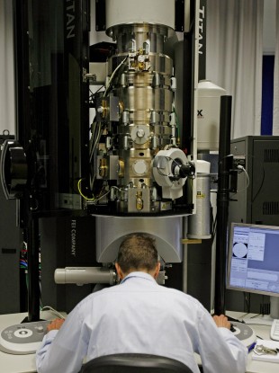 r Markus Boese at the controls of a transmission electron microscope in the Crann lab.