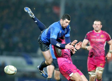 Rob Kearney leaps over Exeter's Luke Arscott.