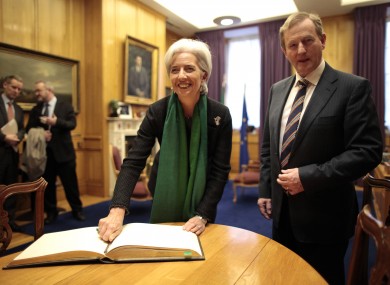 IMF managing director Christine Lagarde signs the guest book in the Taoiseach's Office.