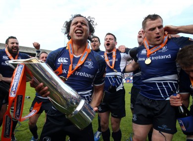 Isa Nacewa is surrounded by celebrating Leinster teammates.