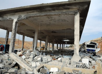 This photo released by the Syrian official news agency SANA shows a general view of damaged buildings wrecked by an Israeli airstrike, in Damascus, Syria, Sunday, May 5, 2013.