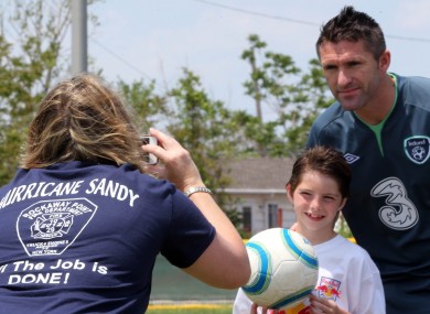Ireland captain Robbie Keane with a young fan.