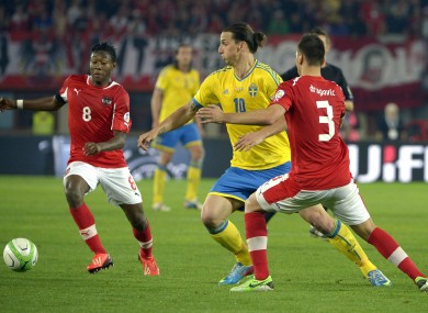 Sweden's Zlatan Ibrahimovic with David Alaba and Aleksandar Dragovic of Austria.