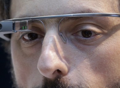 Google co-founder Sergey Brin wears a Google Glass device
