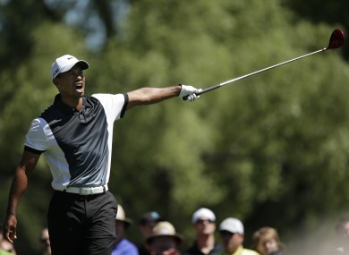 Tiger Woods reacts after his drive went left on the ninth hole during the third round.