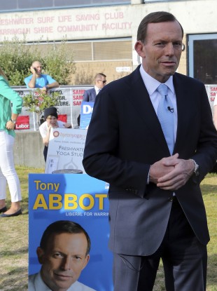 Tony Abbott arrives to cast his vote at Freshwater Surf Life Saving Club in Sydney earlier today.