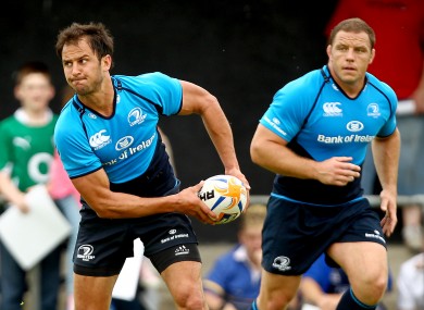 Mat Berquist spins a pass in training as Heinke van der Merwe looks on.