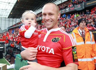 Paul Warwick and his daughter, Éire, celebrate Munster's league success in 2011.