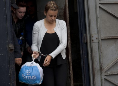 Police escort Melissa Reid and Michaella McCollum Connolly to their hearing