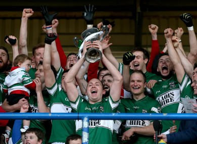 Portlaoise's Brian McCormack lifts the trophy.