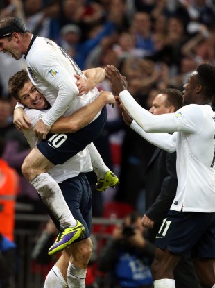 England's Steven Gerrard celebrates scoring his side's second goal with Wayne Rooney.