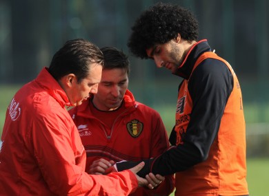 Belgium's head coach Marc Wilmots, team doctor Kris Van Crombrugge and Fellaini.